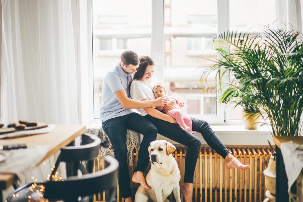 young family with infant and dog safe with home security services