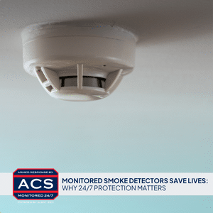 Smoke detector mounted on a home ceiling - Monitored Smoke Detectors Save Lives